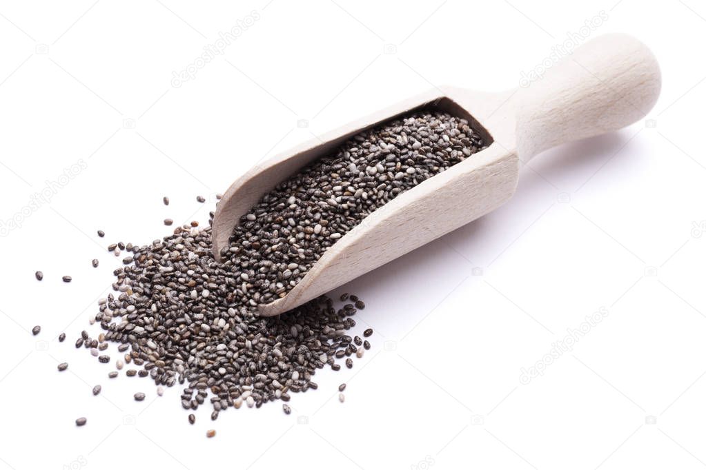 Chia seeds in wooden scoop isolated on white background, healthy superfood. Above view