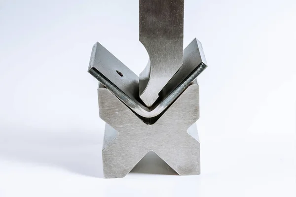 Sheet metal bending tool and equipment isolated on a white background. Special Bending machine Forming mold punch and die. Press brake tools, bend tools, press brake punch and die.