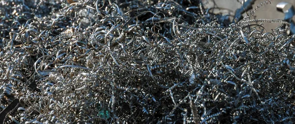 Metal shavings. Wastes from iron production. Metal processing on CNC machines in production.