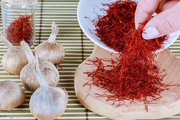 Saffron sativus bulb on a wooden background. — Stock Image Saffron sativus bulb on a wooden background. Royalty Free Stock Photos