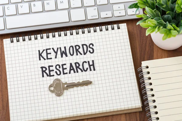 Keywords research for seo concept on wooden desk