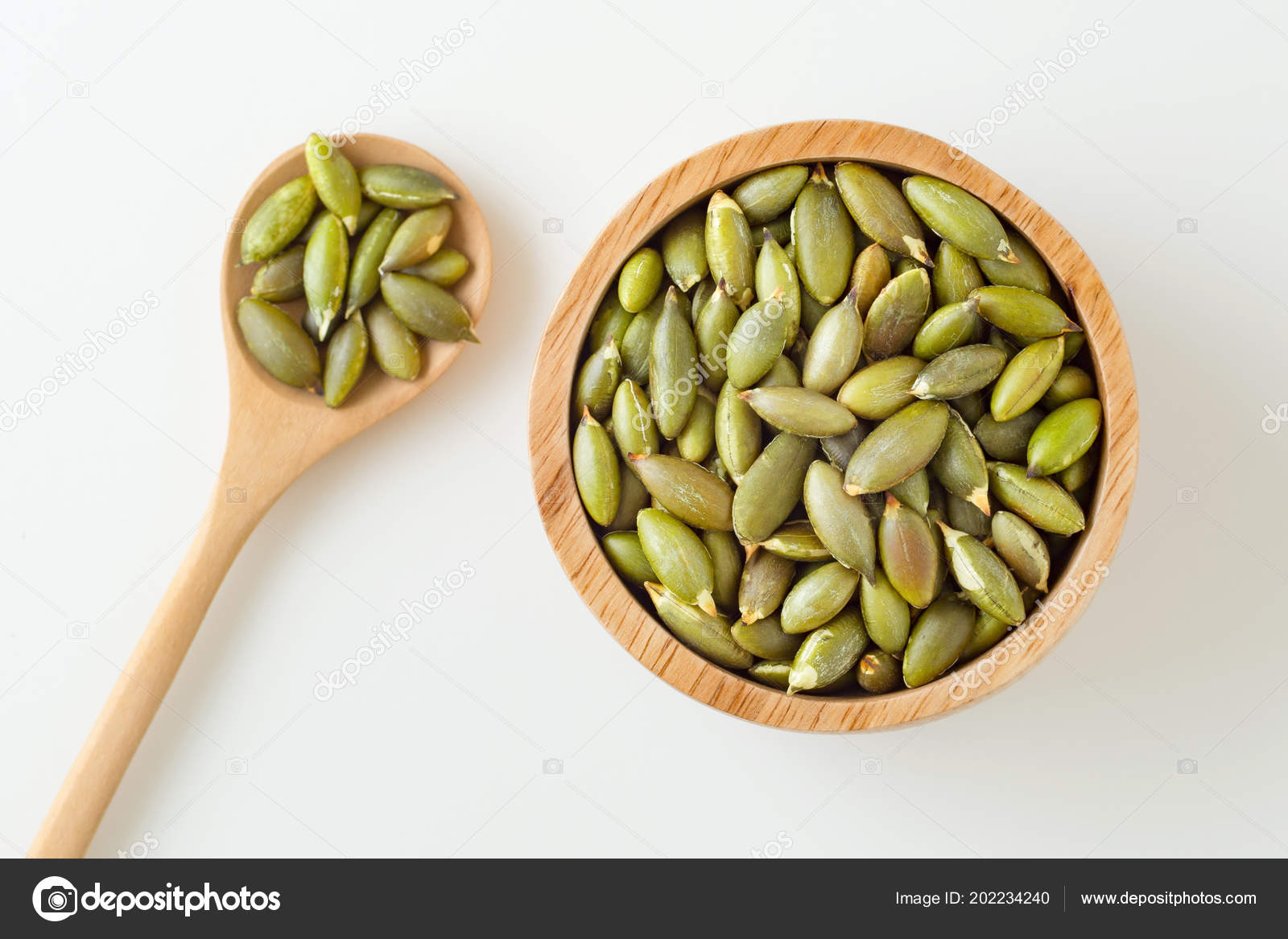 Download Pumpkin Seeds Wooden Bowl Spoon White Background Top View Stock Photo C Myshot 202234240 Yellowimages Mockups