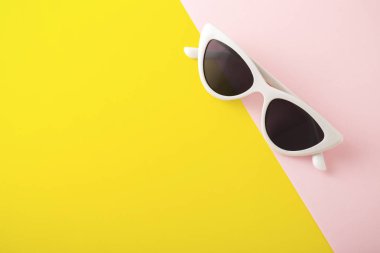 Sunglasses on yellow background clipart
