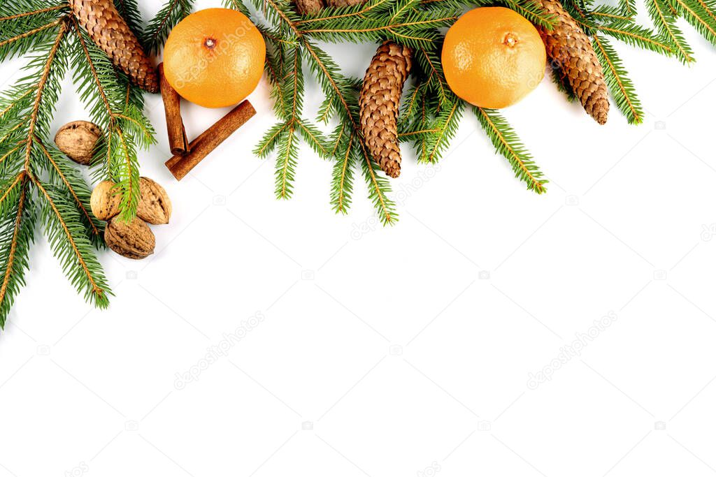 Christmas frame made with twigs, cones and citrus isolated on white