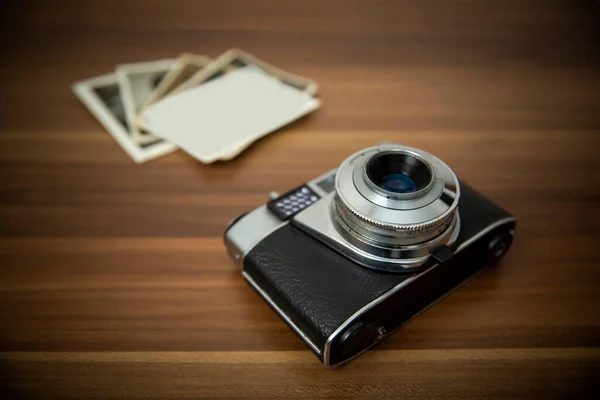 Vintage film camera on wood background