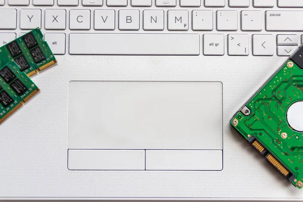 Laptop and notebook data storage components like hdd, hard disk drive, ram memory show data backup, data security and technical archive solutions for digital information on modern computer equipment