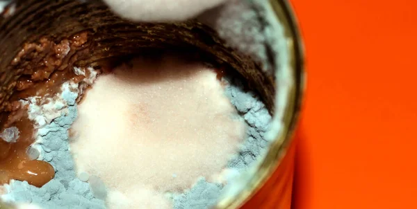 Mold in the food jar. Spoiled food. Toxic canned food.