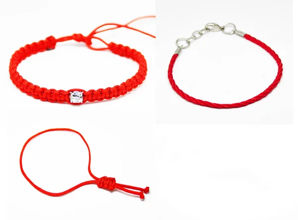 Delicate decorative bracelet woven from red rope. — Stock Photo, Image