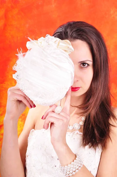 Dark-haired girl in a wedding corset on an abstract background Royalty Free Stock Photos