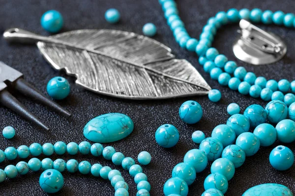 Natural stones turquoise,  beads,  tools and accessories for making jewelry. Needlework.