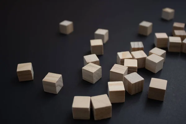 Wooden small blocks on the background. Background for desktop. Office style.Agile and scrum. Team players.Social life.In the office.Equality and diversity
