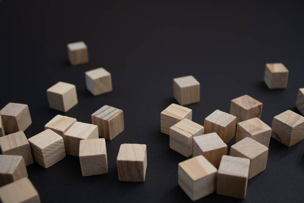 Wooden small blocks on the background. Background for desktop. Office style.Agile and scrum. Team players.Social life.In the office.Equality and diversity