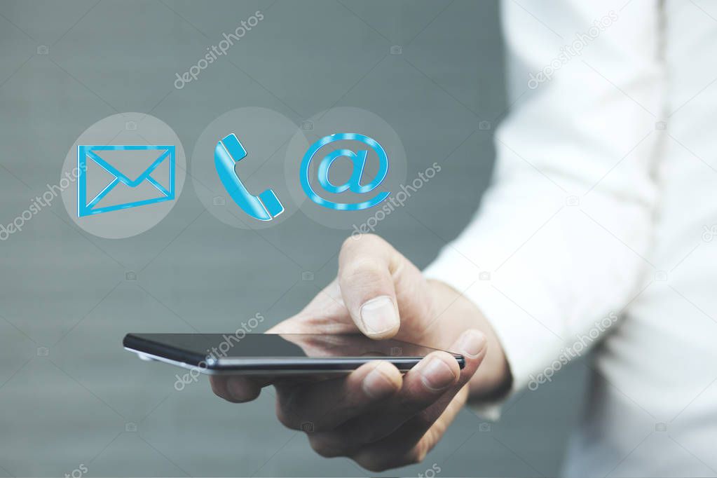 Man with  mobile phone while  contact icons