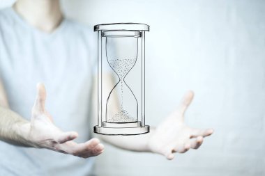 Kum saati simgesi tutan elini. İş