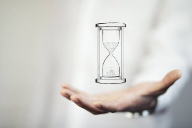 Adamın elini tutarak kum saati. İş