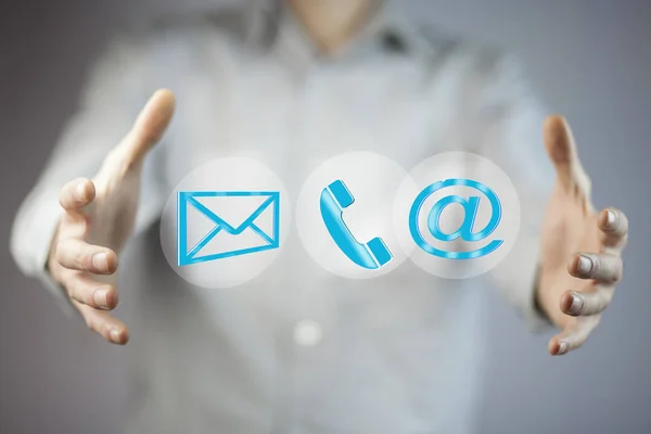 Business man\'s  hands with  message, phone and mail marks on screen