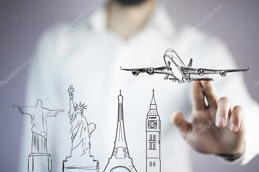 Businessman touching  airplane travel around the world