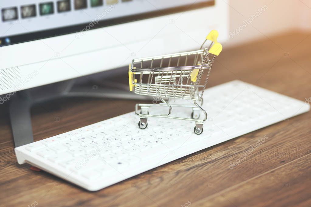shopping basket on a computer keyboard. Shopping 