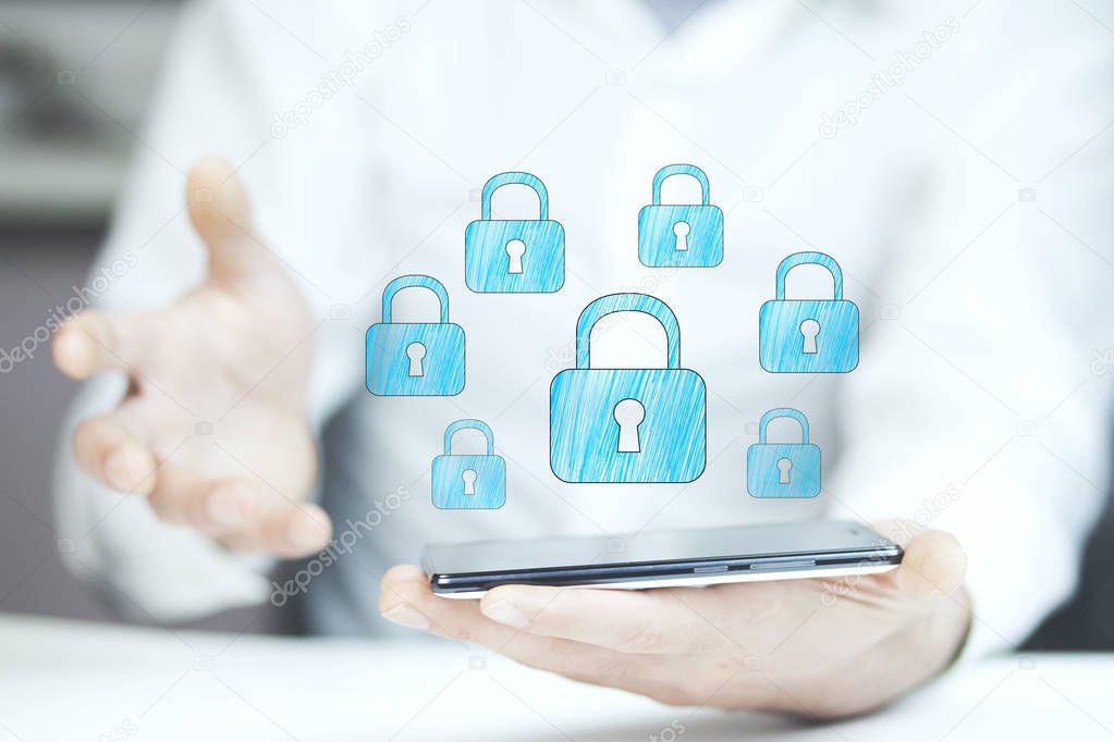 businessman holding  phone with  locks above screen 