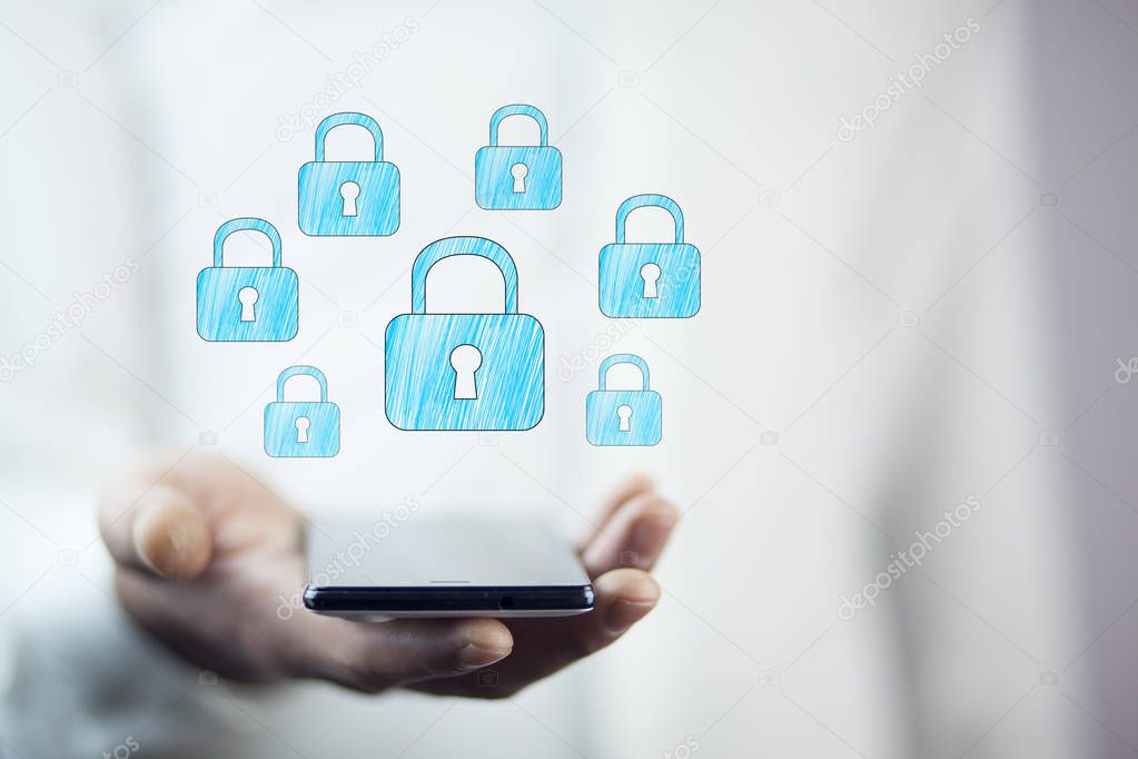 businessman holding  phone with  locks above screen 