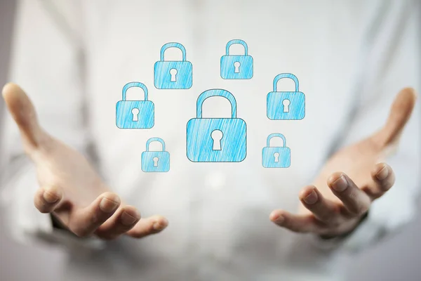 businessman's  hands with  locks icons