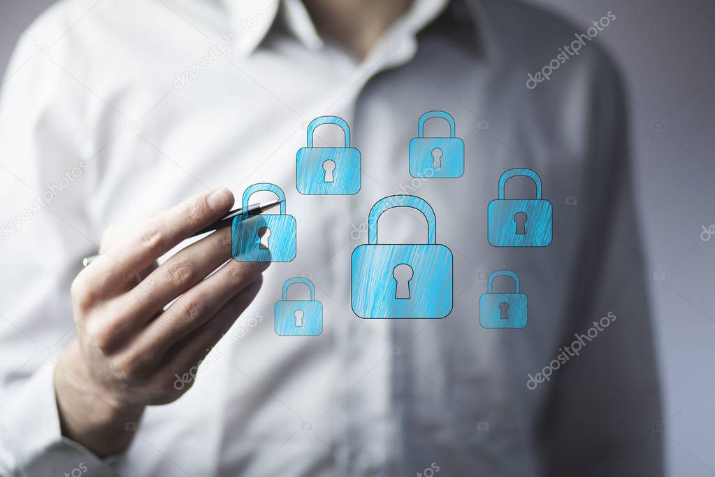 businessman's  hand drawing  locks on screen