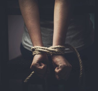 Detail of female hands tied up with rope clipart