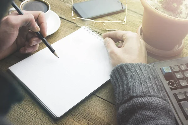 Male Hands Pencil Writing Notebook Keyboard Coffee Cup Plant Smartphone — Stock Photo, Image