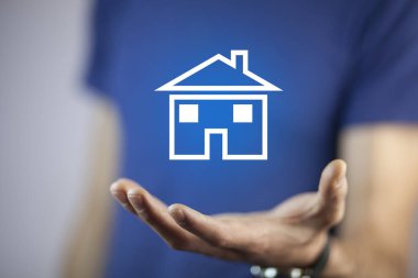 man hand blue house model  in screen clipart