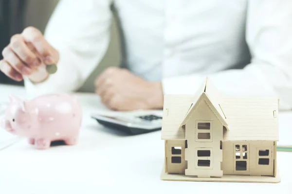 Male Hands Piggy Bank Money House Model Table — Stock Photo, Image