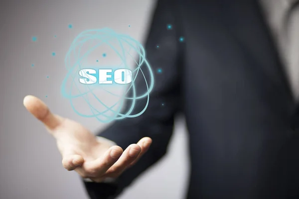 Seo Simgesi Holding Adamı Kavramı — Stok fotoğraf