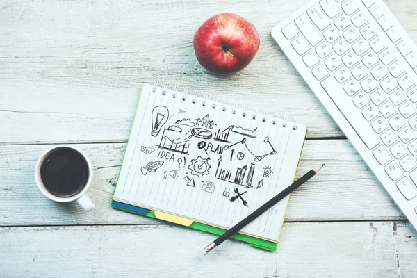 Sketch   with keyboard and coffee   on wooden table