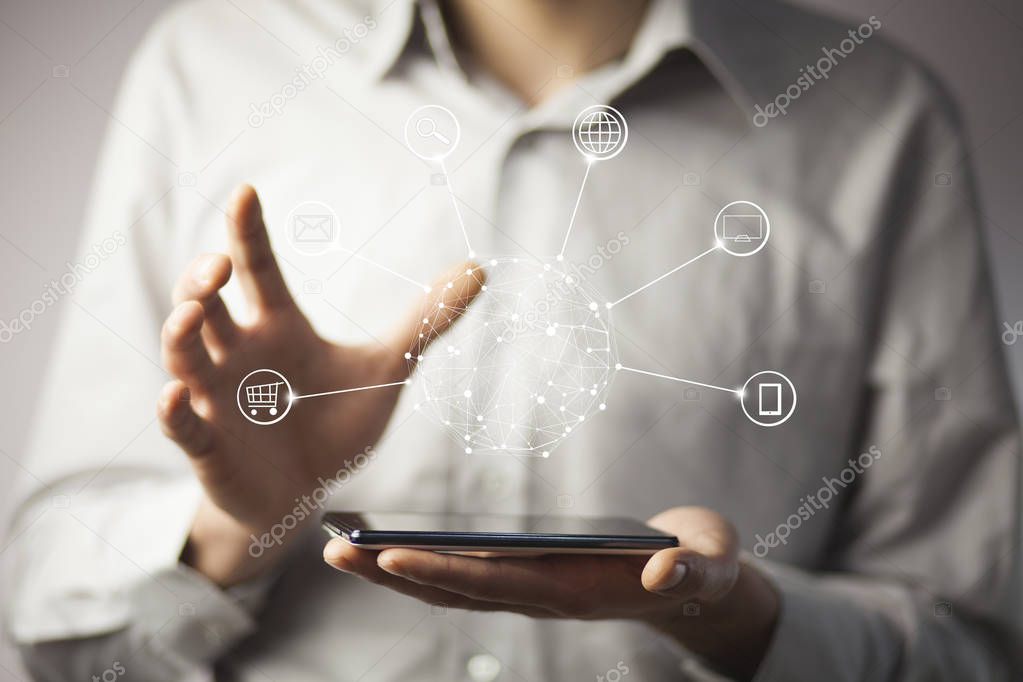 man holding phone with circle global network connection icon 