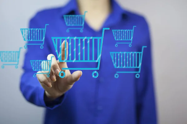 Businesswoman Touching Shopping Baskets Icons Gray Background — Stock Photo, Image