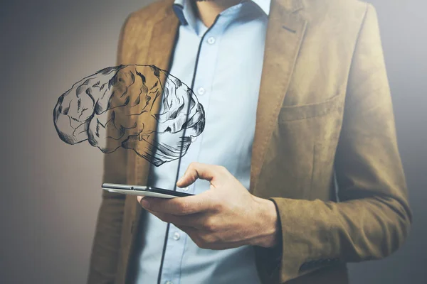 Close up of businessman  holding phone  brain with brain icon above