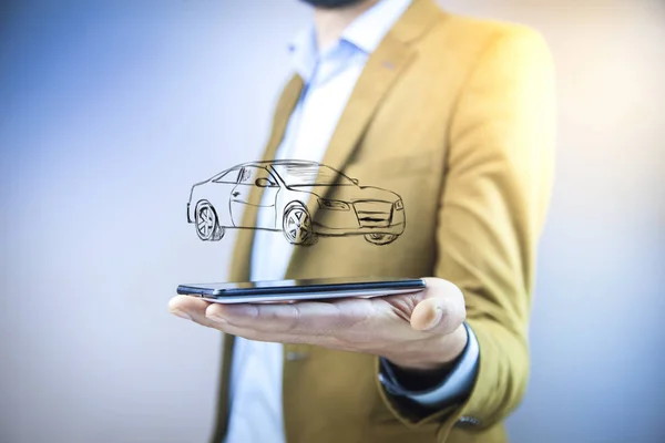 businessman holding  phone with car icon above