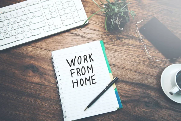 notebook written work from home text and keyboard on table