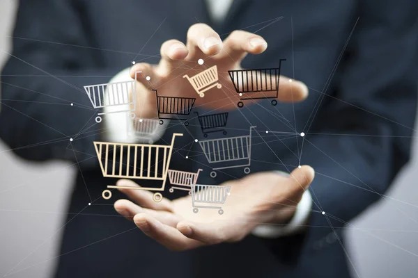 Businessman hand baskets in screen — Stock Photo, Image