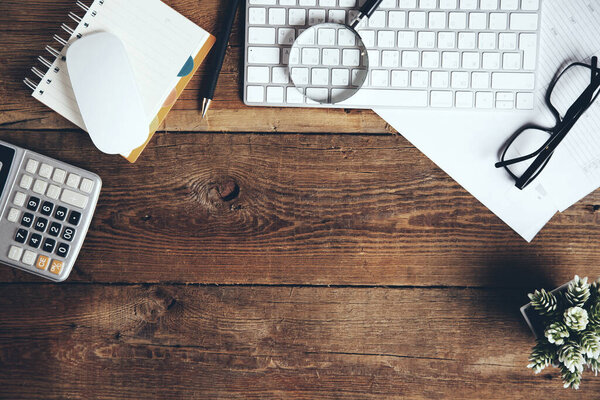 stationary with keyboard on wooden desk