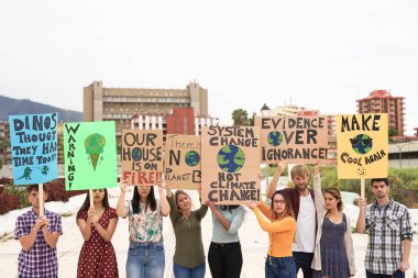 People protesting against climate change. Young people from different countries showing their ideology. Young together under same defense - Image clipart