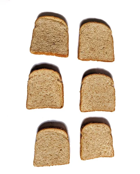 Plátky Celozrnného Chleba Bílém Pozadí Zdravá Výživa — Stock fotografie