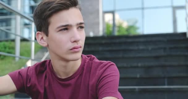 Close Portrait Caucasian Young Man Sits Steps Outdoors Portrait Sad — Stock Video