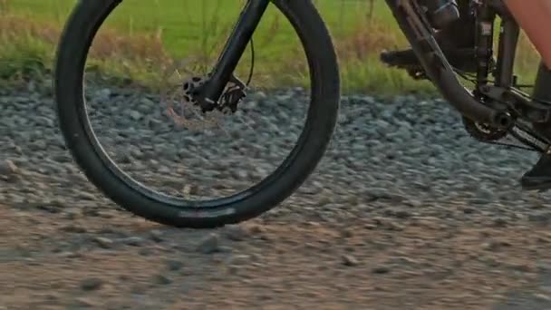 Close Bicycle Wheel Driving Gravel Slow Motion Cyclist Pedaling Pedals — Stock Video