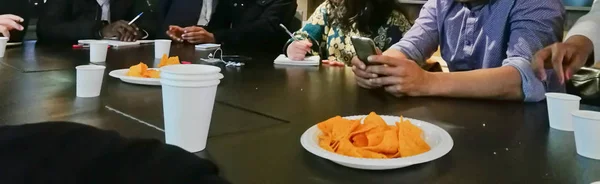 Cheesy corn chips snack on a table of start-up meeting — Stock Photo, Image