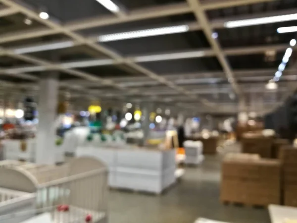 Defocused blurry scene of self service furniture indoor warehouse
