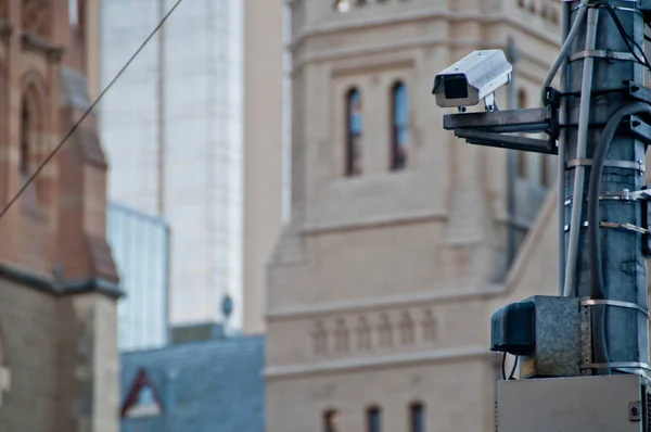 Surveillance CCTV street outdoor camera watching pedestrian