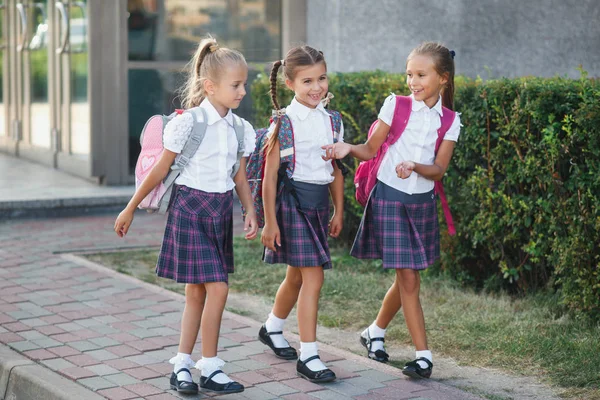 Group of elementary school kids running at school — Stock Photo, Image