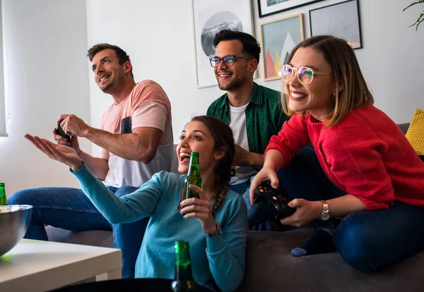 Group of friends playing online game at home