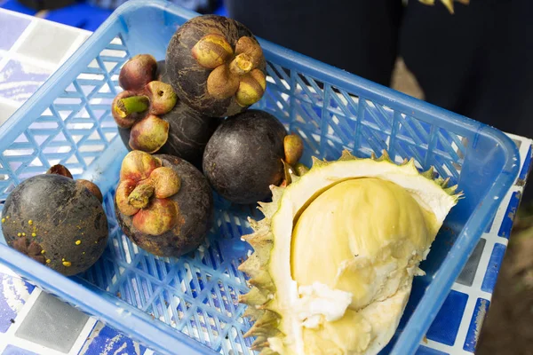 Durian fruit peeling and Mangosteens for people eat in fruits buffet festival at shop in countryside between Chanthaburi to Rayong, Thailand