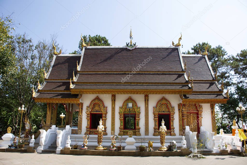 Thai people and traveler foreigner travel visit and respect praying chedi and Buddha's relics at Wat Phra That Doi Tung on Febuary 22, 2018 in Chiang Rai, Thailand